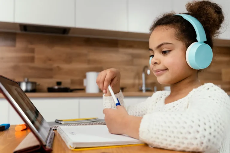 Young homeschool student taking an online assessment on a laptop at home