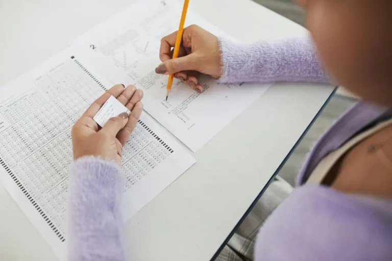 Young student taking the Iowa Assessments standardized test at home