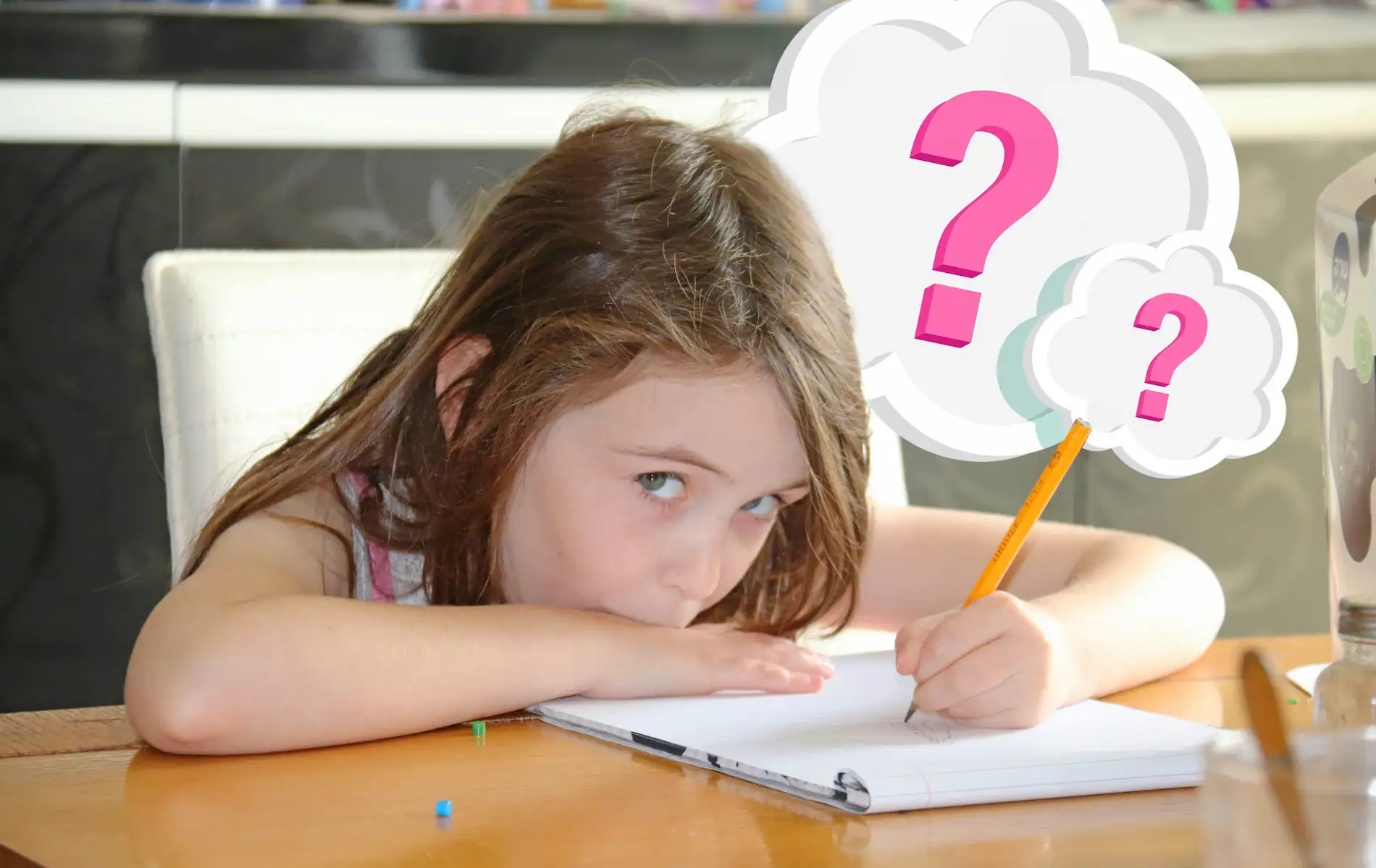 Confused child sitting at a desk while struggling with homeschool work.